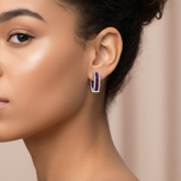 Model wearing diamond ruby hoops