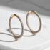 Rose gold diamond eternity hoops studio shot