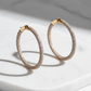Rose gold diamond eternity hoops studio shot